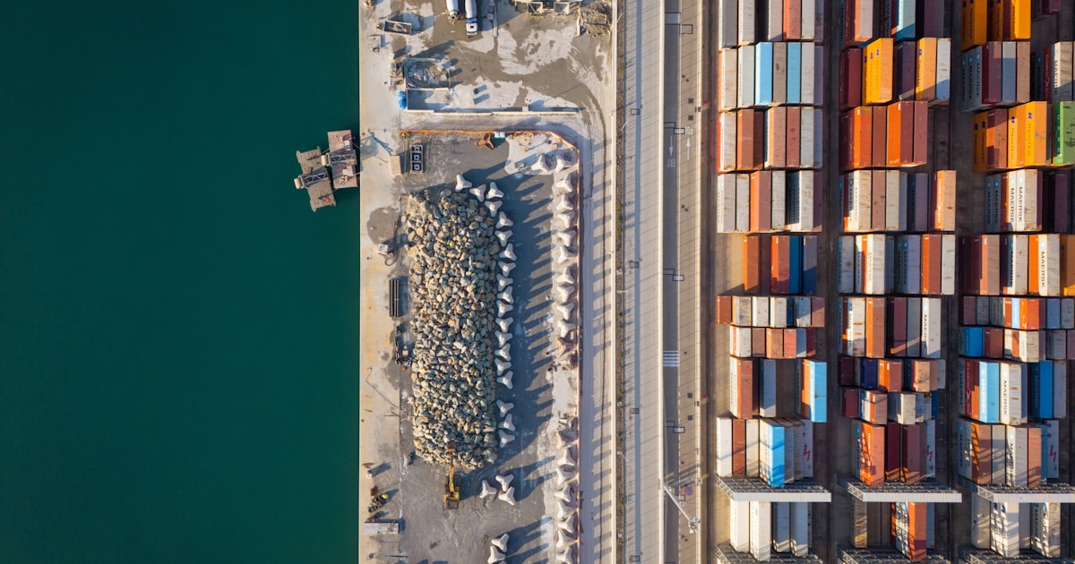 Aerial view of a busy container port, representing container shipping cost from China to Bangladesh