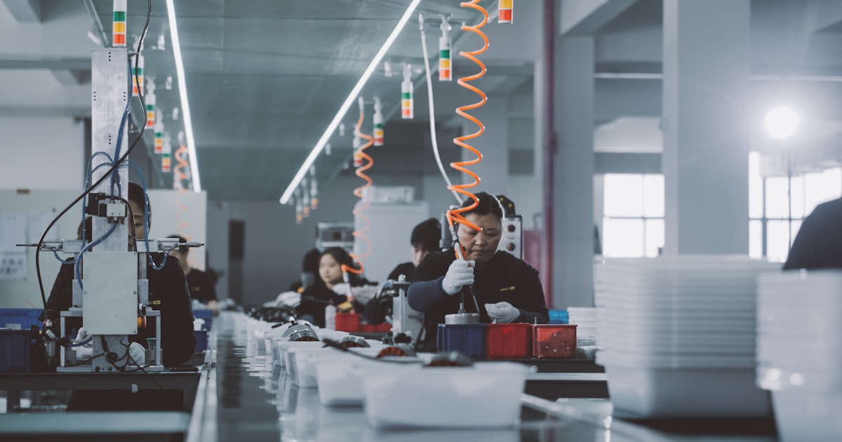 Workers on a factory production line, representing how to find a reliable supplier on Alibaba