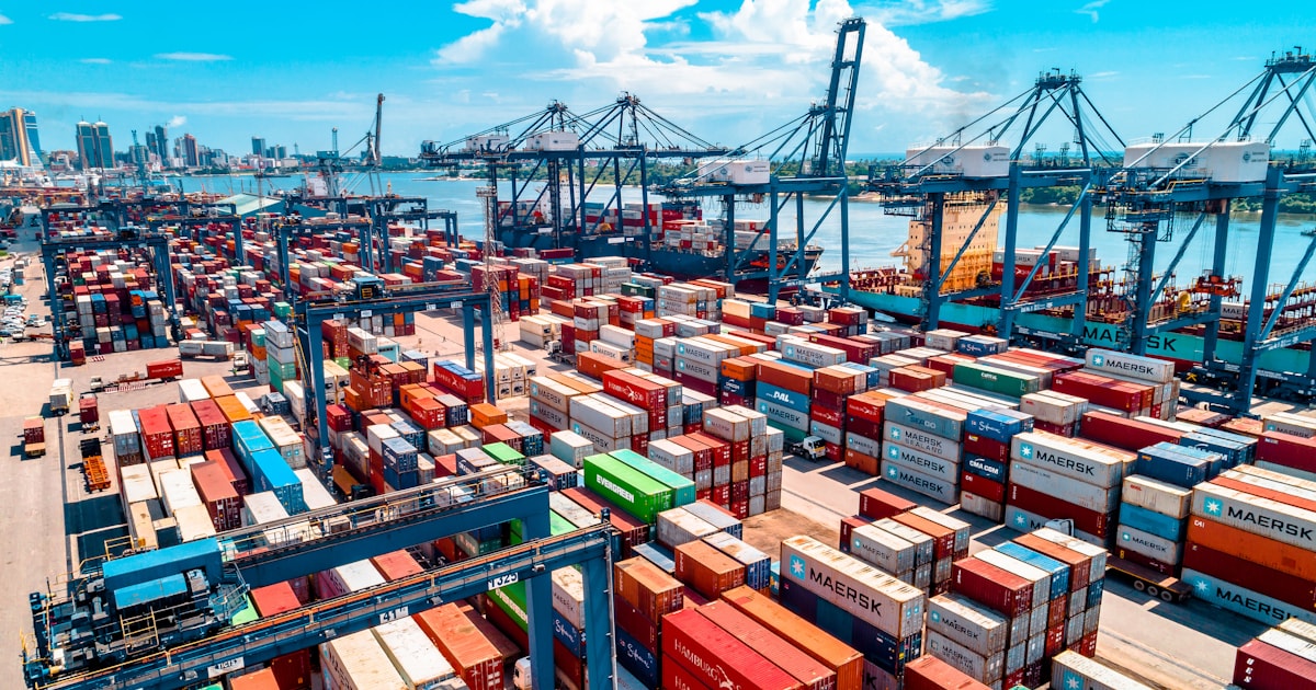 Shipping containers stacked at a container yard, illustrating LCL versus FCL shipping options