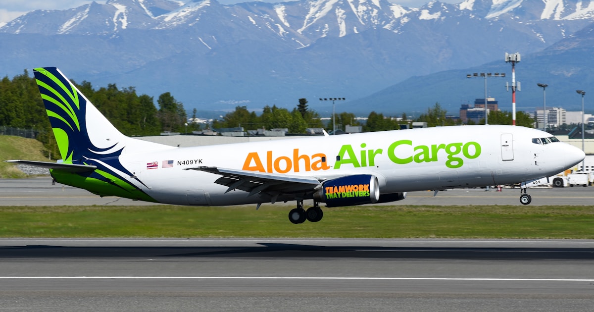 Cargo airplane landing, illustrating air freight versus sea freight shipping from China to Bangladesh