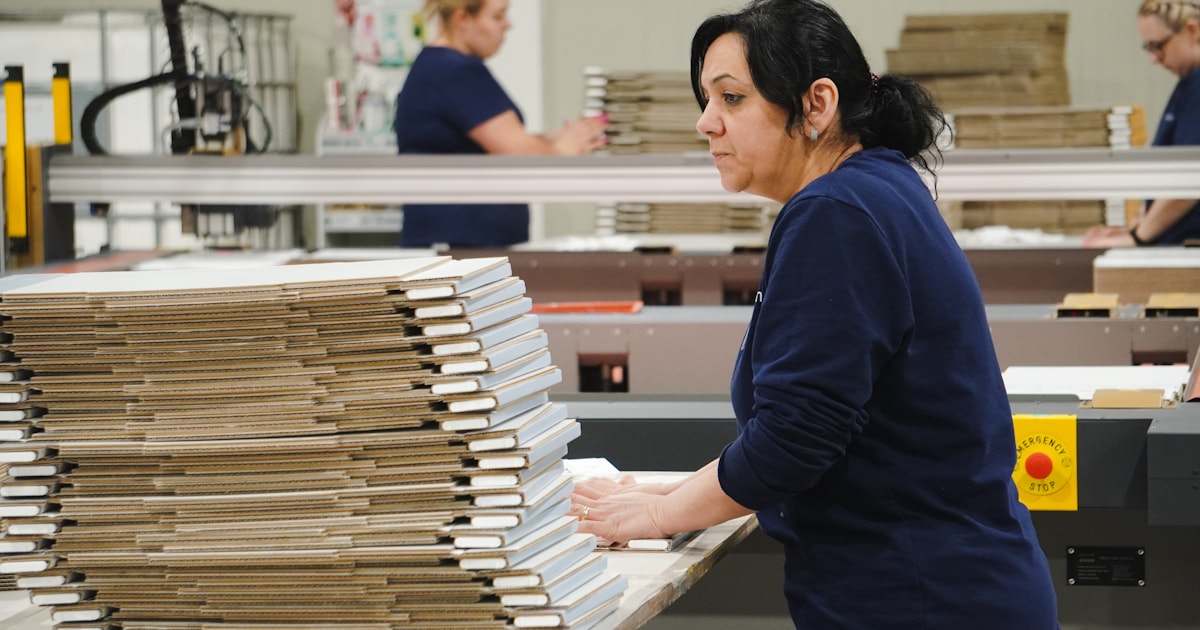 Warehouse worker sorting shipment boxes, illustrating what an HS code is and why it matters